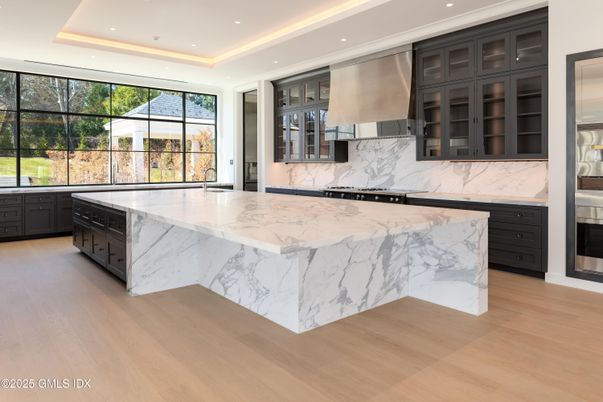 Interior, Kitchen, Marble Walls, Recessed Lighting, Stainless Steel Appliances, Wood Texture Flooring