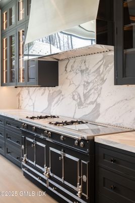 Interior, Kitchen, Marble Walls, Stainless Steel Appliances, Wood Texture Flooring
