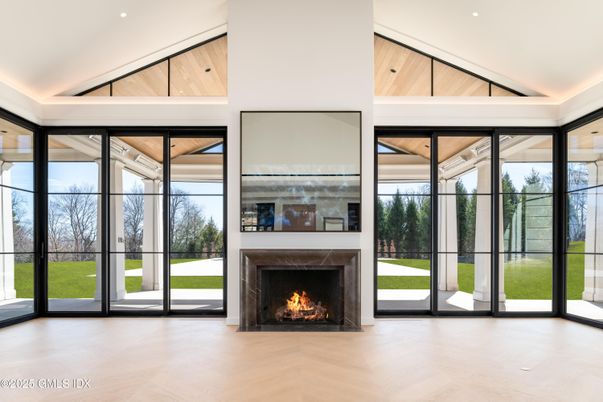 Fireplace, Interior, Recessed Lighting, Sun Room, Wood Texture Flooring