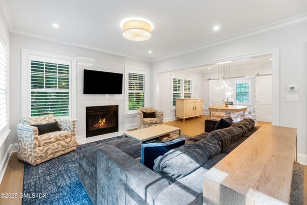 Dining room, Fireplace, Interior, Living room, Pendant Lights, Recessed Lighting, Wood Texture Flooring