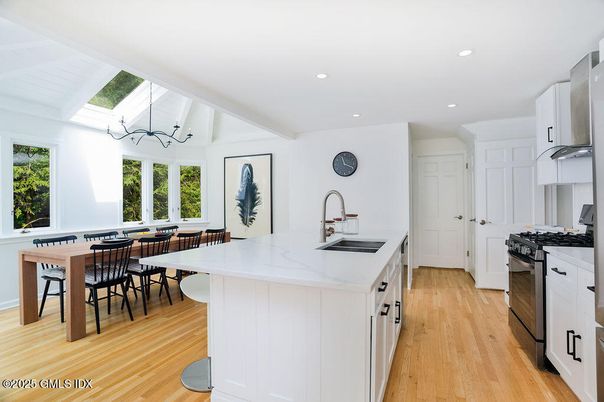 Dining room, Interior, Kitchen, Recessed Lighting, Stainless Steel Appliances, Wood Texture Flooring