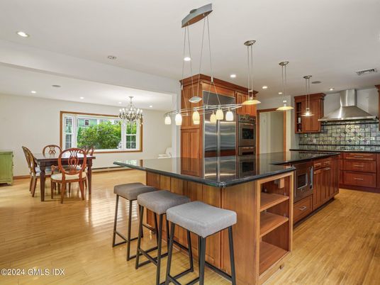 Chandelier, Dining room, Interior, Kitchen, Pendant Lights, Recessed Lighting, Stainless Steel Appliances, Wood Texture Flooring