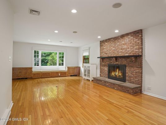 Empty room, Fireplace, Interior, Recessed Lighting, Stone Walls, Wood Texture Flooring
