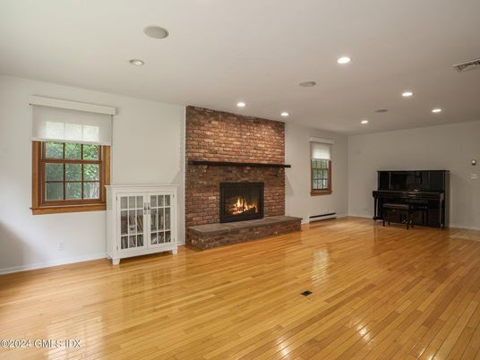 Fireplace, Interior, Piano, Recessed Lighting, Stone Walls, Wood Texture Flooring