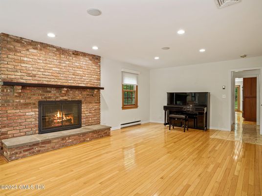 Fireplace, Interior, Piano, Recessed Lighting, Stone Walls, Wood Texture Flooring