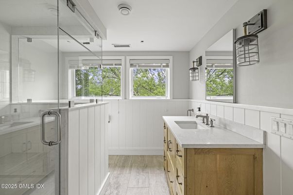 Bathroom, Dual Sink Vanities, Glass Shower, Interior, Recessed Lighting, Wood Texture Flooring