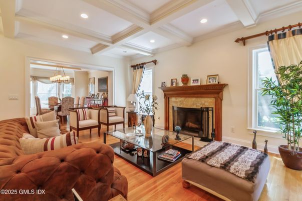 Chandelier, Dining room, Fireplace, Interior, Living room, Recessed Lighting, Wood Texture Flooring