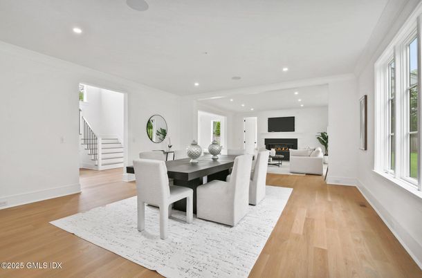 Dining room, Fireplace, Interior, Living room, Recessed Lighting, Wood Texture Flooring