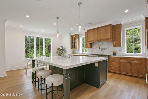 Interior, Kitchen, Marble Walls, Pendant Lights, Recessed Lighting, Wood Texture Flooring