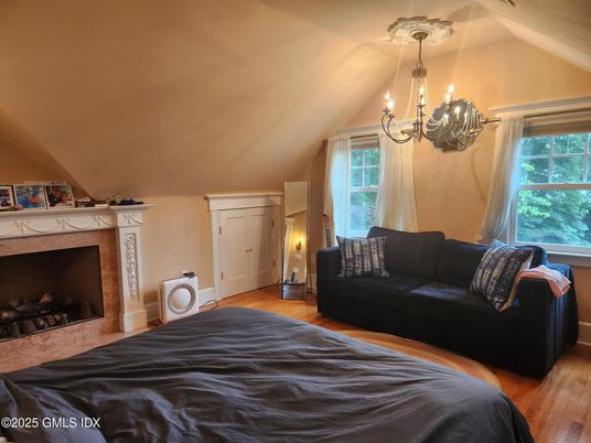 Bedroom, Chandelier, Fireplace, Interior, Wood Texture Flooring