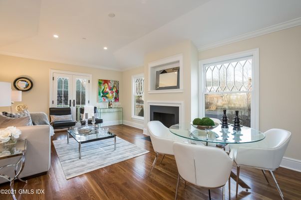 Dining room, Fireplace, Interior, Living room, Recessed Lighting, Wood Texture Flooring