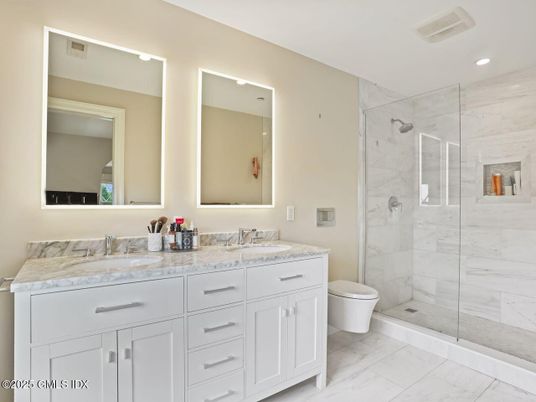 Bathroom, Dual Sink Vanities, Glass Shower, Interior, Marble, Marble Walls, Recessed Lighting