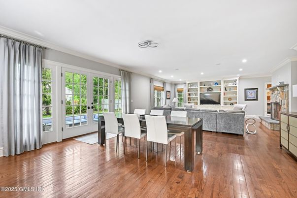 Dining room, Fireplace, Interior, Living room, Recessed Lighting, Wood Texture Flooring