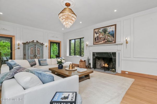 Chandelier, Fireplace, Interior, Living room, Recessed Lighting, Wood Texture Flooring