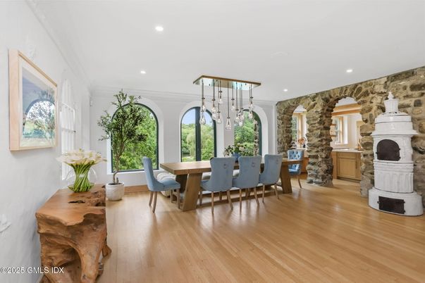 Dining room, Fireplace, Interior, Pendant Lights, Recessed Lighting, Stone Walls, Wood Texture Flooring