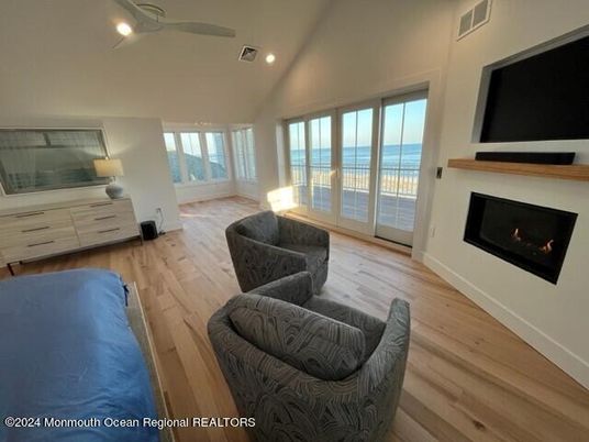 Fireplace, Interior, Living room, Recessed Lighting, Water, Wood Texture Flooring