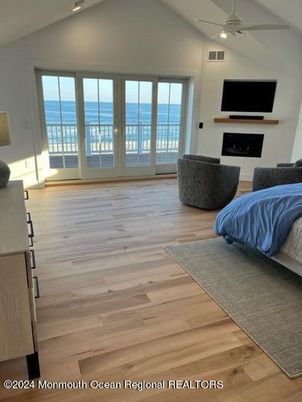 Bedroom, Fireplace, Interior, Water, Wood Texture Flooring