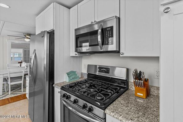 Dining room, Interior, Kitchen, Recessed Lighting, Stainless Steel Appliances, Wood Texture Flooring