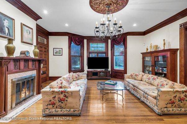 Chandelier, Fireplace, Interior, Living room, Recessed Lighting, Wood Texture Flooring