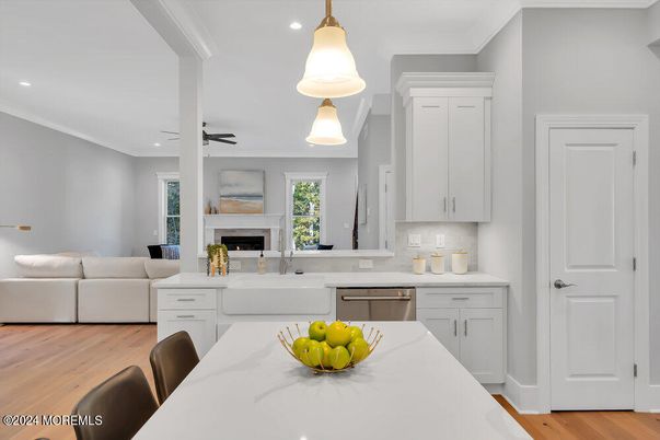 Fireplace, Interior, Kitchen, Living room, Pendant Lights, Recessed Lighting, Stainless Steel Appliances, Wood Texture Flooring