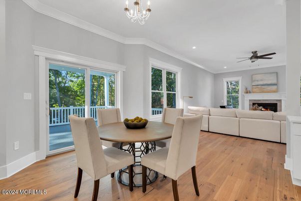 Dining room, Fireplace, Interior, Living room, Recessed Lighting, Wood Texture Flooring
