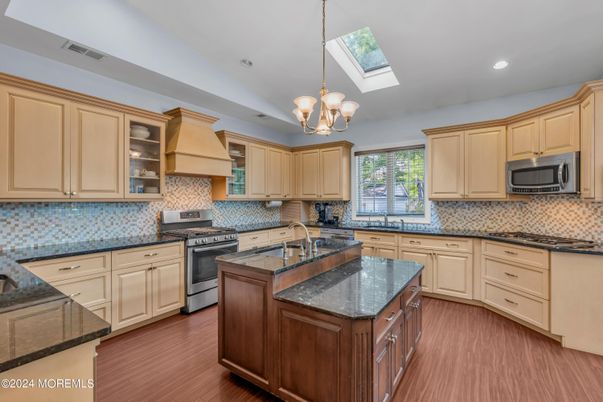 Chandelier, Interior, Kitchen, Pendant Lights, Recessed Lighting, Stainless Steel Appliances, Wood Texture Flooring