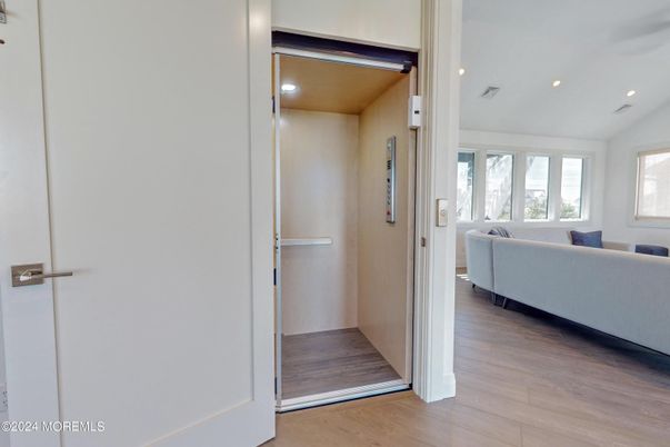 Elevator, Interior, Living room, Recessed Lighting, Wood Texture Flooring