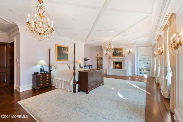Bedroom, Chandelier, Fireplace, Interior, Recessed Lighting, Wood Texture Flooring