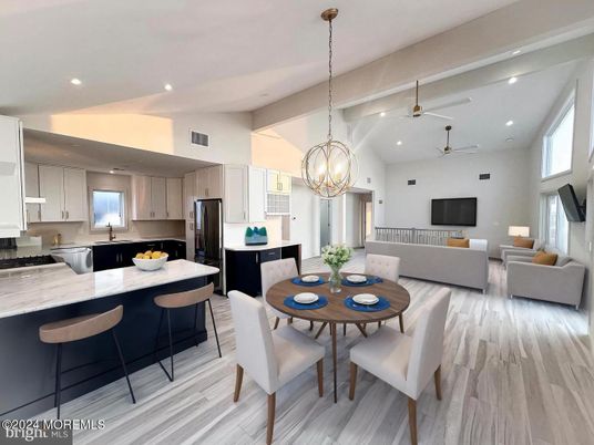 Chandelier, Dining room, Interior, Kitchen, Living room, Pendant Lights, Recessed Lighting, Stainless Steel Appliances, Wood Texture Flooring