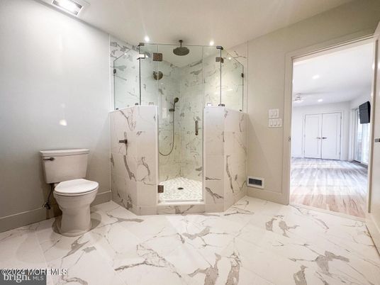 Bathroom, Glass Shower, Interior, Marble, Marble Walls, Recessed Lighting, Wood Texture Flooring
