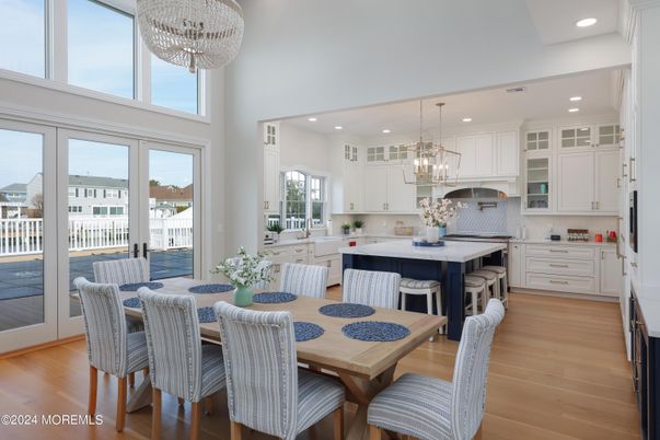 Chandelier, Dining room, Interior, Kitchen, Pendant Lights, Recessed Lighting, Stainless Steel Appliances, Wood Texture Flooring