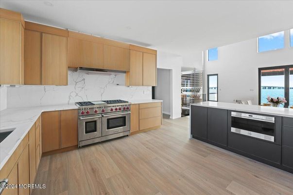 Interior, Kitchen, Marble Walls, Stainless Steel Appliances, Wood Texture Flooring