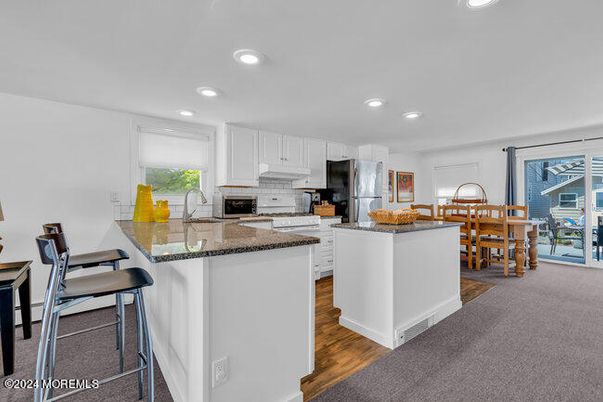 Dining room, Interior, Kitchen, Recessed Lighting, Stainless Steel Appliances, Wood Texture Flooring