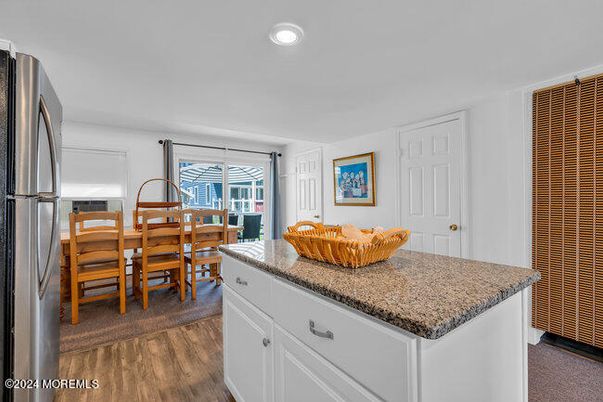 Dining room, Interior, Kitchen, Recessed Lighting, Stainless Steel Appliances, Wood Texture Flooring