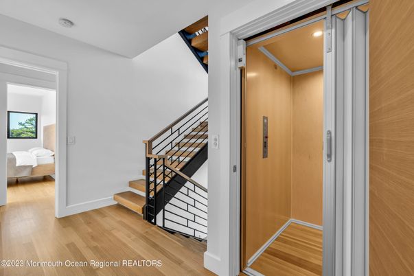 Elevator, Interior, Recessed Lighting, Wood Texture Flooring, Wooden Walls
