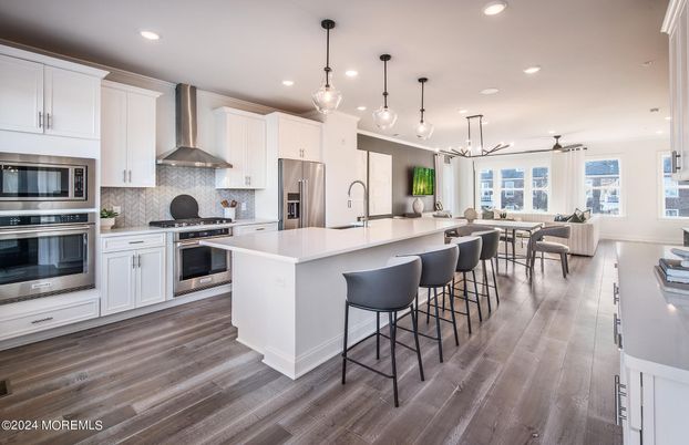 Dining room, Interior, Kitchen, Pendant Lights, Recessed Lighting, Stainless Steel Appliances, Wood Texture Flooring