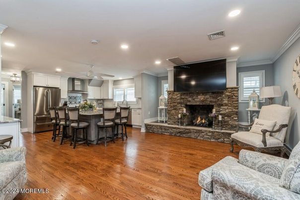 Fireplace, Interior, Kitchen, Recessed Lighting, Stainless Steel Appliances, Wood Texture Flooring