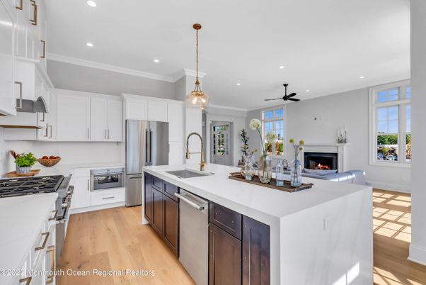 Fireplace, Interior, Kitchen, Pendant Lights, Recessed Lighting, Stainless Steel Appliances, Wood Texture Flooring