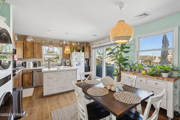 Dining room, Interior, Kitchen, Pendant Lights, Stainless Steel Appliances, Wood Texture Flooring