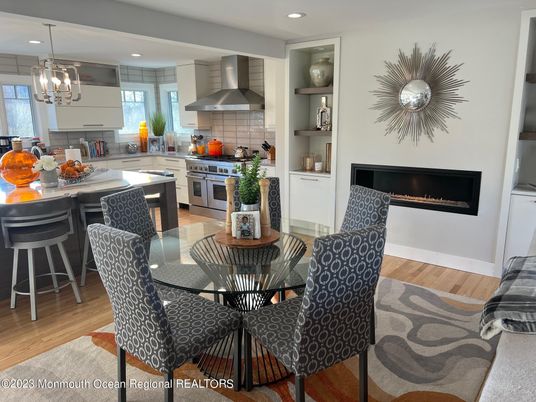 Dining room, Fireplace, Interior, Kitchen, Pendant Lights, Recessed Lighting, Stainless Steel Appliances, Wood Texture Flooring