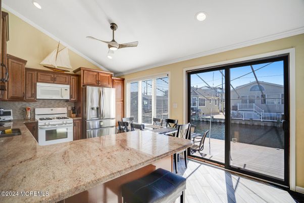 Dining room, Interior, Kitchen, Recessed Lighting, Stainless Steel Appliances, Wood Texture Flooring