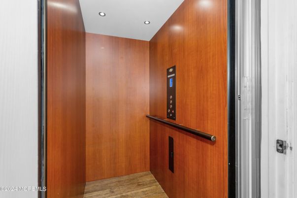 Elevator, Interior, Recessed Lighting, Wood Texture Flooring, Wooden Walls