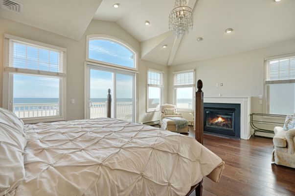 Bedroom, Chandelier, Fireplace, Interior, Recessed Lighting, Water, Wood Texture Flooring