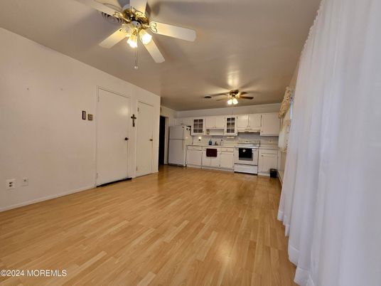 Empty room, Interior, Kitchen, Stainless Steel Appliances, Wood Texture Flooring