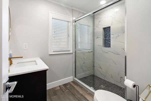 Bathroom, Glass Shower, Interior, Marble Walls, Recessed Lighting, Wood Texture Flooring
