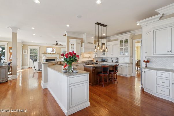 Dining room, Fireplace, Interior, Kitchen, Living room, Pendant Lights, Recessed Lighting, Stainless Steel Appliances, Wood Texture Flooring