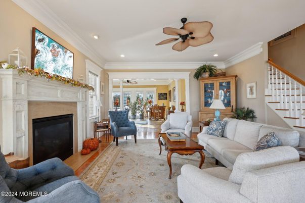 Dining room, Fireplace, Interior, Living room, Recessed Lighting, Wood Texture Flooring