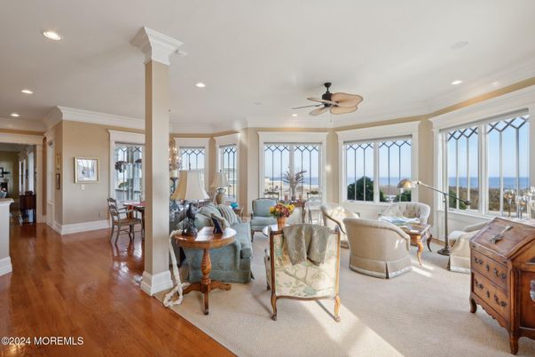 Dining room, Fireplace, Interior, Living room, Recessed Lighting, Water, Wood Texture Flooring