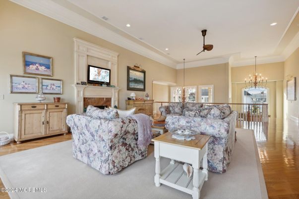 Chandelier, Fireplace, Interior, Living room, Pendant Lights, Recessed Lighting, Wood Texture Flooring