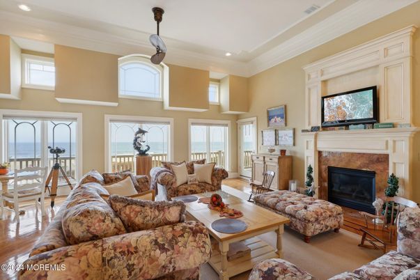 Dining room, Fireplace, Interior, Living room, Recessed Lighting, Water, Wood Texture Flooring